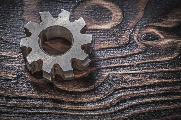 Rough rotary cutter on vintage wood board top view construction concept
