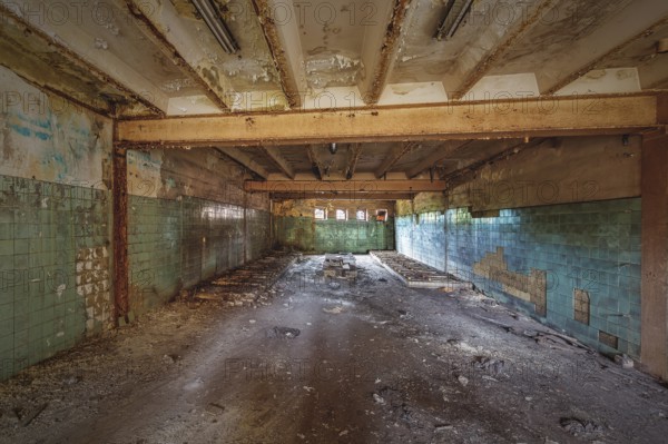 Abandoned and dilapidated interior of a school with green tiles and ceiling beams, HF6, Lost Place, Seraing, Province of Liège, Belgium, Europe