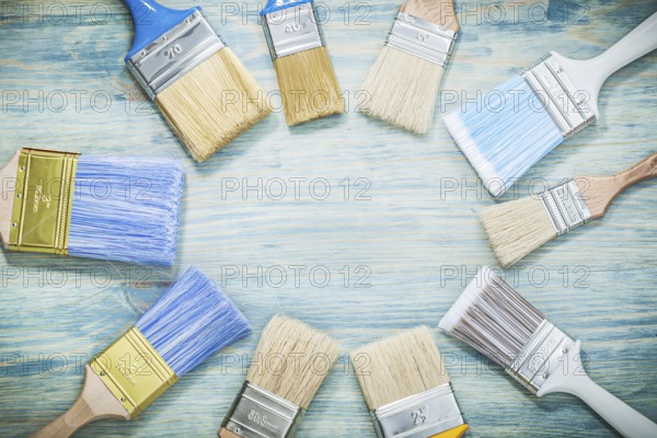 Paintbrushes on wooden board construction concept
