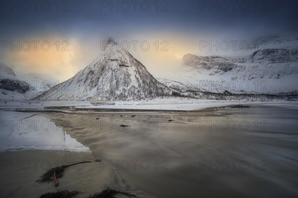 Beautiful winter landscape scene in Ersfjord and mountain in background in Northern Norway. sunset or sunrise in Mountains And Fjords. Kliptinden Grovla