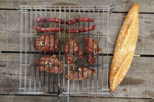 Barbecue sausages lamb meat grill bread on wooden table