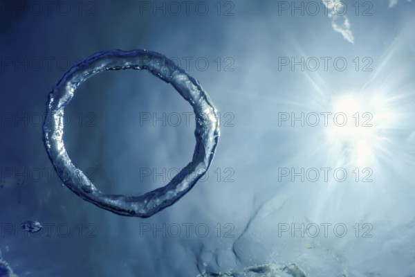 Bubble Ring Underwater ascends towards the Sun