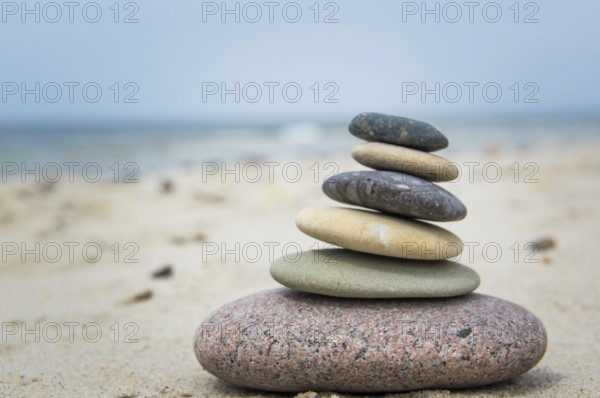 Round pebbles on the beach in Denmark is a symbol for harmony. Stones on the beach in Denmark is a symbol for harmony