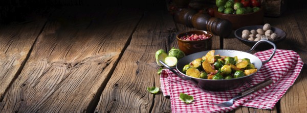 Brussels sprouts potato pan with bacon in a rustic style