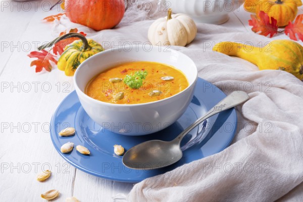 Healthy pumpkin soup with ginger, carrots and coconut milk