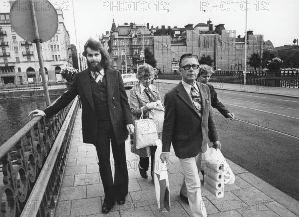 Clark Olofsson. Swedish criminal born 1947. A Swedish criminal now living in Belgium. He has received sentences for attempted murder, assault, robbery, and dealing narcotics and has spent more than half of his life in correctional institutions in Sweden. Olofsson has been called Sweden's first celebrity gangster. Olofsson was present at the Norrmalmstorg robbery whose events resulted in the creation of the phrase Stockholm syndrome to describe them. Picture taken 1974 in Norrköping when he was serving a jail sentence for the robbery of Krediitbanken at Norrmalmstorg Stockholm, and have permission to be outside the prison gates for a few days. On march 20 1975 Olofsson escaped from this prison On 11 May 2020, Netflix announced Clark - a six episode drama series about Clark Olofsson. Olofsson will be played by Bill Skarsgård and Jonas Åkerlund will be directing
