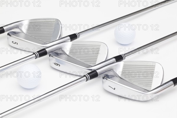 Titanium golf clubs on the white background