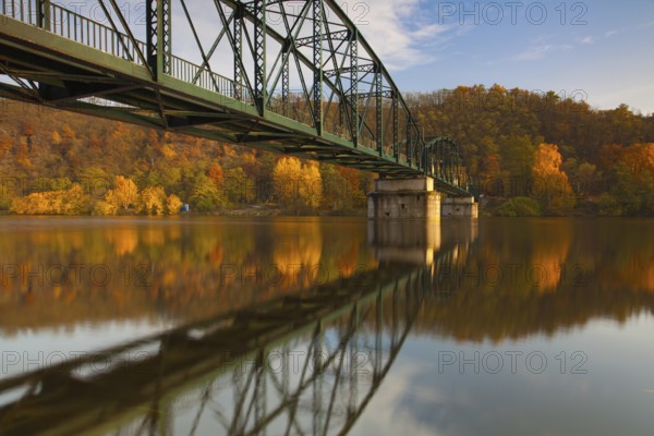 Footbridge over the Vltava river in Davle in Czech Republic. Autumn scenery