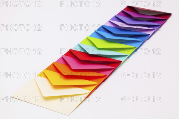 Different colored envelopes on the white background