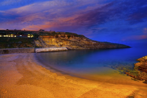 Llanes Playa del Sablon beach sunset in Asturias of Spain