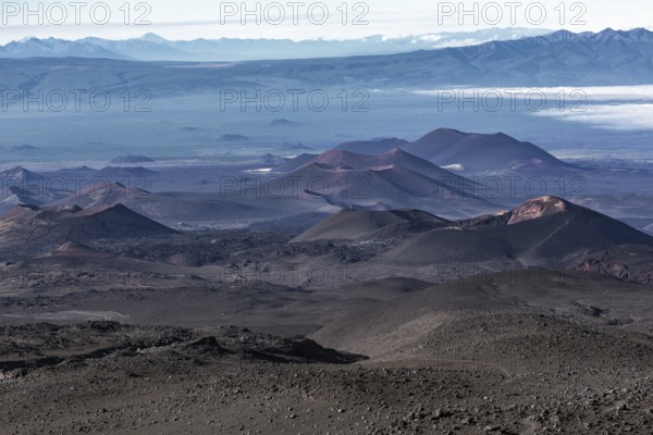 Beautiful volcano landscape of Kamchatka Peninsula: series of cinder cones and lava fields of fissure eruptions Plosky Tolbachik Volcano. Russian Far East, Kamchatka, Klyuchevskaya Group of Volcanoes