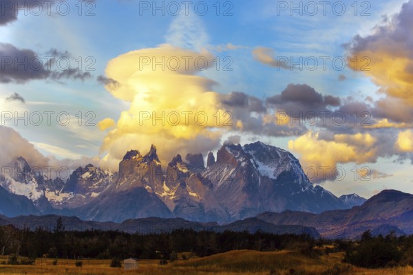 The famous Torres del Paine park in southern Chile. South America. Patagonia. The magical exotic beauty of the curved cliffs of Los Cuernos and clouds of incredible shapes. Sunset