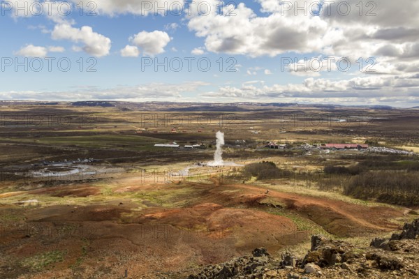 View on Geyser valley, Haukadalur geyser erupting