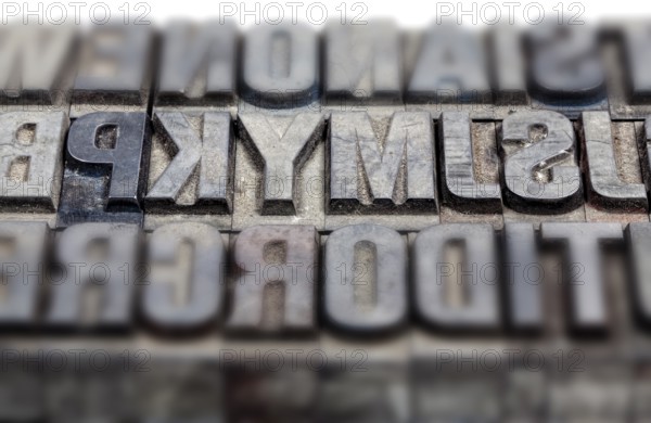 Hot metal printing setting, old letters made of lead for letterpress printing, Lettern aus dem Buchdruck, Bleisatz