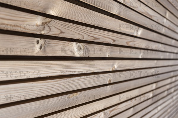 Close up of Wood paneling background texture. Modern ecological wooden facade thermal insulation