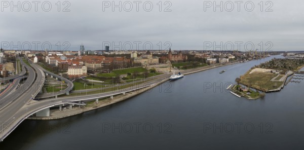 Aerial view of Chrobry Shafts, moored ships on the Oder River and castle like buildings of National Museum, Szczecin, Poland, Europe