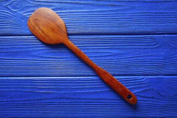 Chef tool spatula on a blue wooden background