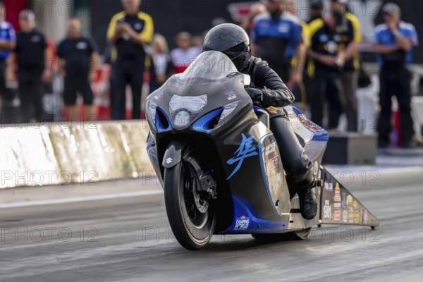 Sep 22, 2023-Concord, NC: NHRA Pro Stock Motorcycles Series driver, Kelly Clontz, runs down the lane during a qualifying session for the Betway Carolina Nationals