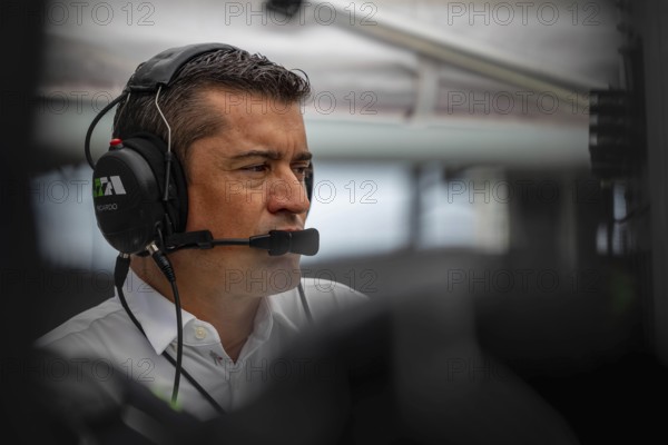 INDYCAR team owner, RICARDO JUNCOS, watches his team work on their Juncos Hollinger Racing car before a practice session for the Indianapolis 500 at Indianapolis Motor Speedway in Indianapolis, IN, USA, North America