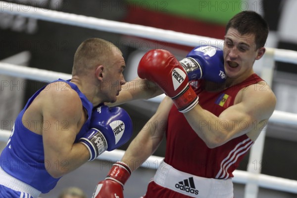 Sofia, Bulgaria - 26 February, 2021: Dmitri Galagot (red) of Moldova and Yevhenii Barabanov of Ukraine fight in their semifinal round of Welter (69kg) category of the 72-nd International Boxing Tournament Strandja 2021, Sofia, Bulgaria, Europe