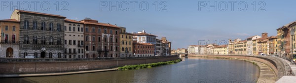 Old picturesque houses at the Arno river waterfront in Pisa, Italy, Europe