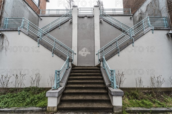 Belgium, 03 15 2019: The symmetric diagonal staircase of the dead end Auguste Snieder street with a view on traditional residential houses, Europe