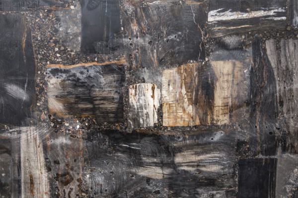 An abstract composition with dark and rugged natural textures, stone, natural stone, stone structure