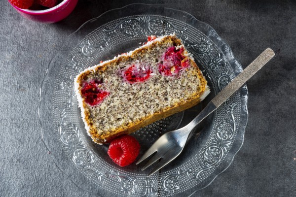 Poppy seed cake with raspberries and desiccated coconut