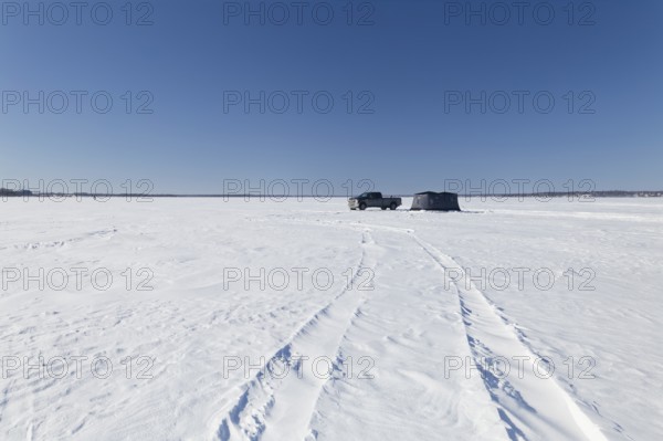 Winter, truck next to a icefishing tent on the frozen Saint Lawrence River, Province of Quebec, Canada, North America