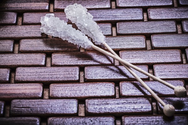 Sweet sugar sticks on wooden matting food and drink concept