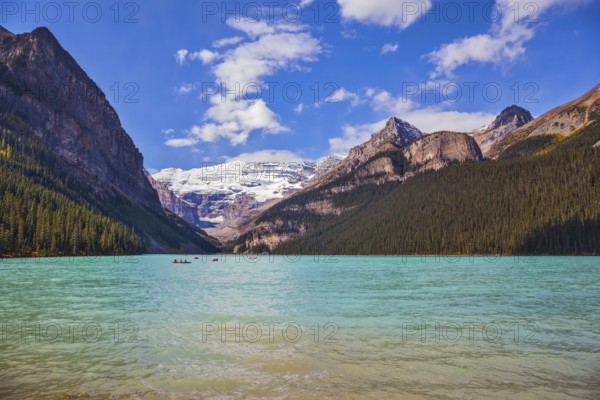Banff National Park, Canada, Alberta. Magnificent Lake Louise with emerald green water surrounded by the Rocky Mountains, pine forests and glaciers, North America
