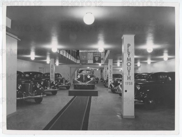 1930s new cars for sale. The swedish representative for General Motors have the brand new car models on display in their showroom. Plymouth, Chystler and De Soto. Sweden 1938