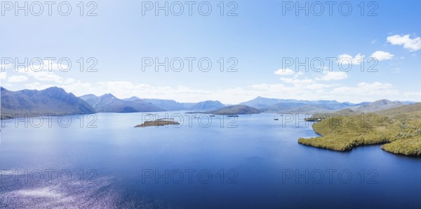 Lake Burbury and surrounding mountain landscape on a warm summer's aftenoon near Queenstown in Tasmania, Australia, Oceania