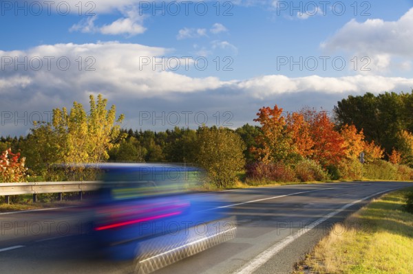 Speed car on a road in Krkonose mountain, Czech Republic, Europe