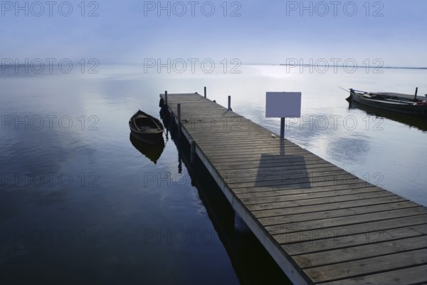 Albufera lake wetlands pier with boat in Valencia Spain