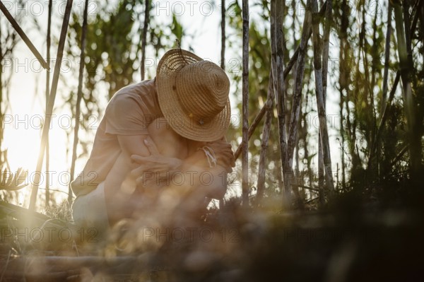 Beautiful Woman with her head down in forest
