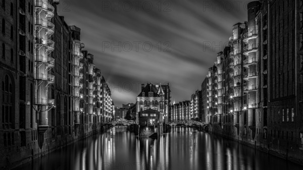 The moated castle in the Speicherstadt photographed from the Poggemühlen Bridge