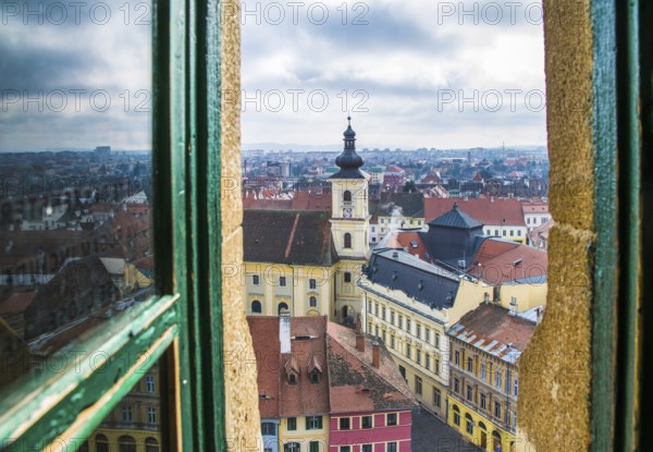 Suning view to Sibiu historic center and Holy Trinity Roman Catholic Church viewed from the Evangelical Church