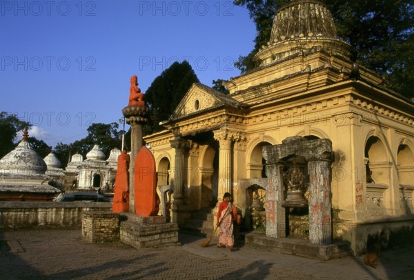 The most revered Hindu site in Nepal is the extensive Pashupatinath Temple complex, five kilometres east of central Kathmandu. The focus of devotion here is a large silver Shivalingam with four faces of Shiva carved on its sides, making it a 'Chaturmukhi-Linga', or four-faced Shivalingam. Pashupati is one of Shiva's 1, 008 names, his manifestation as 'Lord of all Beasts' (pashu means 'beasts', pati means 'lord'), he is considered the guardian deity of Nepal.<br/><br/> The main temple building around the Shivalingam was built under King Birpalendra Malla in 1696, however the temple is said to have already existed before 533 CE. In 733 CE, King Jayadeva II erected in its precincts a stone tablet which chronicled all the kings of Nepal, beginning with the sun god. During the Muslim raids of 1349 the temple was largely destroyed, but in 1381 Jayasinharama Varddhana of Banepa restored it. Further renovations were conducted towards the end of the Malla period, and the latest extensive improv...