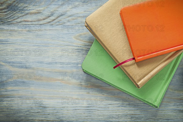 Set of notepads on wooden board education concept