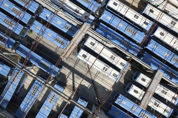Drone aerial top view.photo of abandoned transport Blue buses parking. shabby and broken vehicle. Junkyard of buses Cyprus