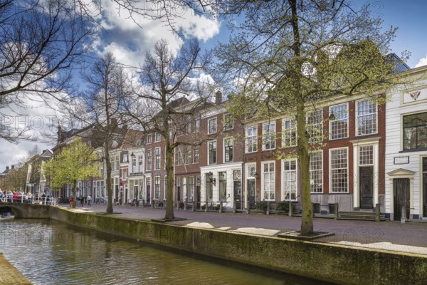 View of Delft canal with historic houses, Netherlands