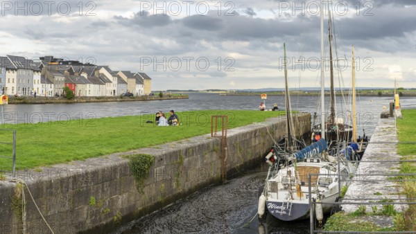 Boat anchored in Eglinton Canal Sea Lock, The Long Walk, Galway, Ireland, United Kingdom, Europe
