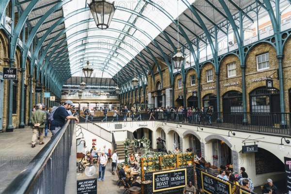 London, UK, May 15, 2019: Interior view of Covent Garden Market. Located in the West End of London, Covent Garden is renowned for its luxury fashion and beauty stores, restaurants and theatres