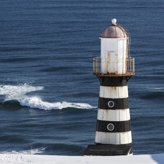 Lighthouse on coast of Pacific Ocean. Russia, Far East, Kamchatka Peninsula, Petropavlovsk-Kamchatsky