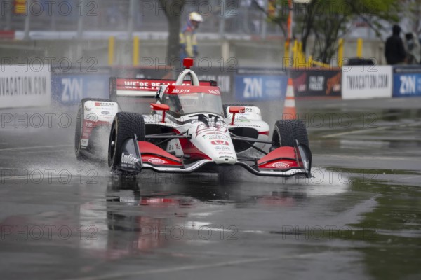 INDYCAR Series driver, STING RAY ROBB (R) (51) of Payette, Idaho, travels through the turns during a wet and dangerous practice session for the Big Machine Music City Grand Prix at Streets of Nashville in Nashville TN