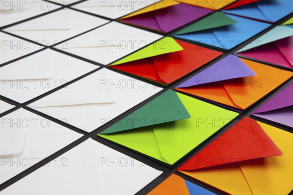 Composition with white and colored envelopes on the table. The photo suitable for various holidays and anniversaries