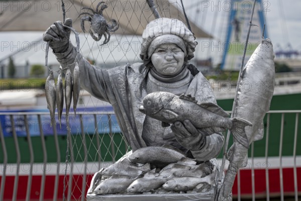 Detailed silver statue of a fisherwoman with fish, Hamburg harbour, Free and Hanseatic City of Hamburg, Germany, Europe