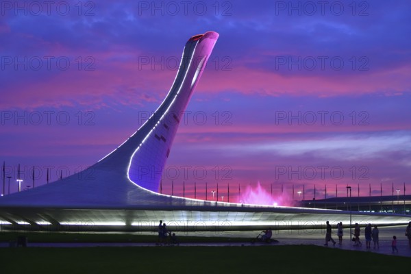 Sochi, Russia, May 29. 2018. Bowl of the Olympic flame Firebird and singing Fountain in the Olympic park in the evening. The main symbol of the Olympic Games of 2014 in Sochi, Europe