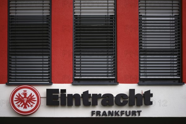 Frankfurt, Germany - August 05, 2017: The coat of arms of the Eintracht Frankfurt sports club on the facade of a club building on 05 August 2017 in Frankfurt, Germany, Europe